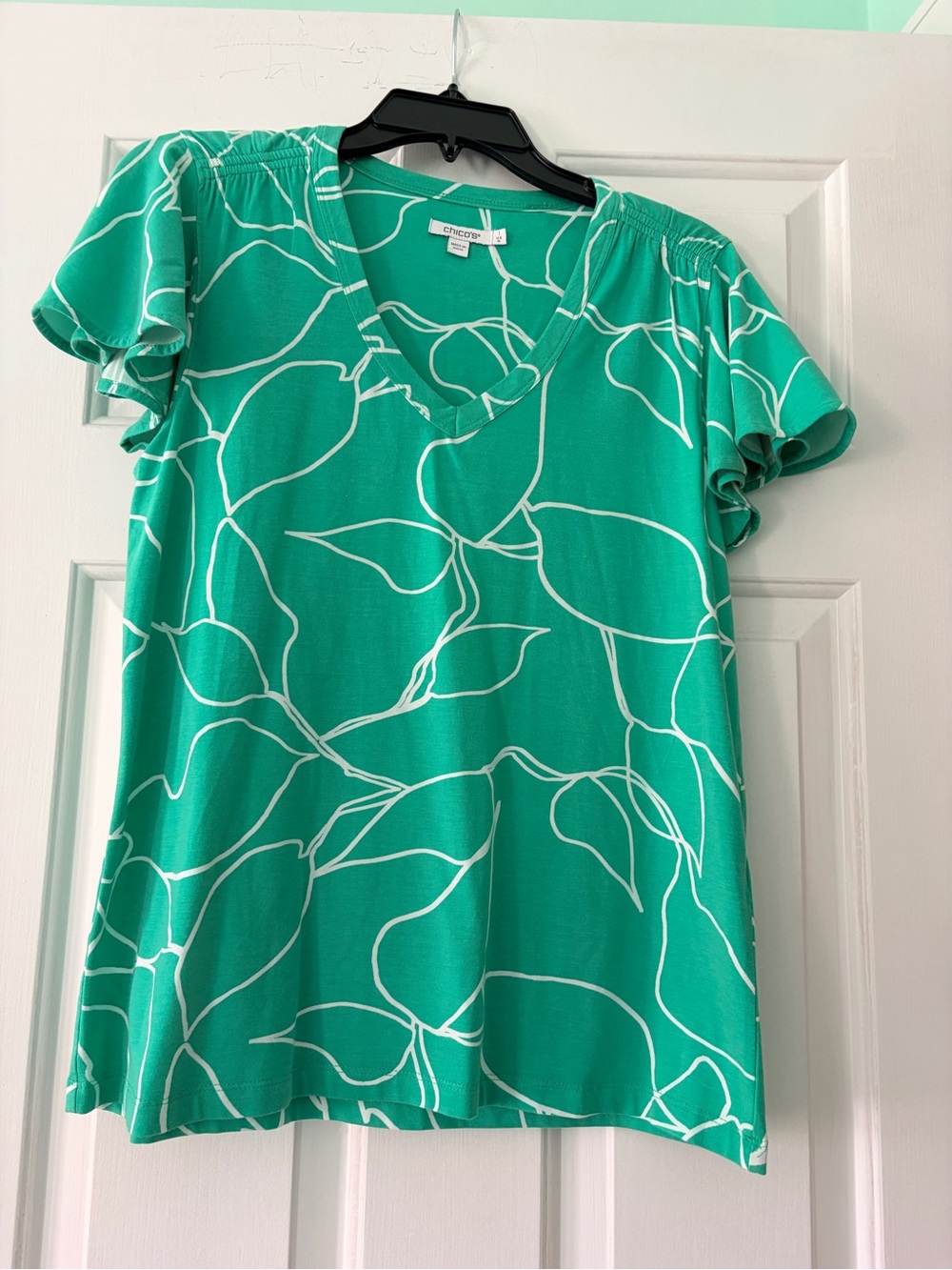 Chico's Teal Green V‑Neck Flutter Sleeve Top with White Leaf Outline